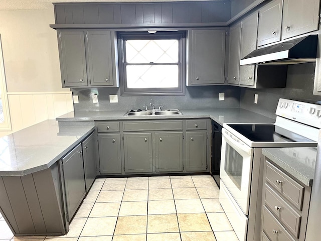 kitchen featuring gray cabinets, light tile patterned flooring, sink, white electric range oven, and kitchen peninsula