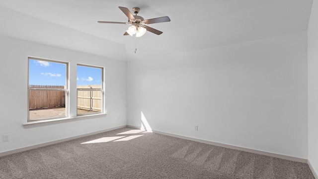 unfurnished room featuring baseboards, a ceiling fan, and carpet flooring