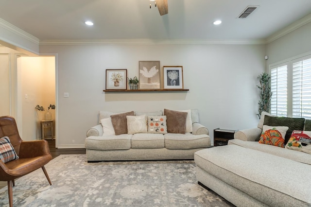 living room featuring wood-type flooring and ornamental molding