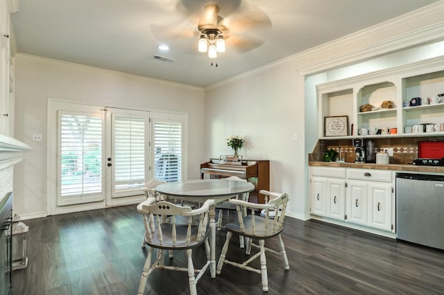 dining space featuring a fireplace, dark wood-type flooring, ornamental molding, and ceiling fan