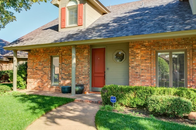 property entrance with a yard