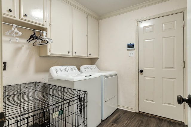 laundry room with cabinets, ornamental molding, dark hardwood / wood-style floors, and independent washer and dryer