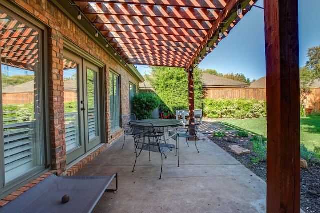 view of patio featuring french doors and a pergola