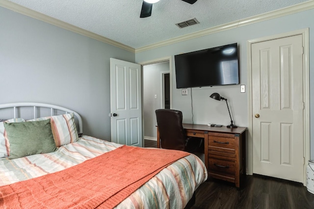 bedroom with ornamental molding, dark wood-type flooring, a textured ceiling, and ceiling fan