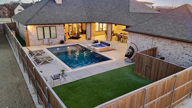 view of swimming pool with a patio, a yard, and an outdoor fire pit