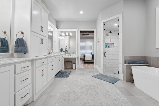 bathroom with ceiling fan, tile patterned floors, vanity, and separate shower and tub