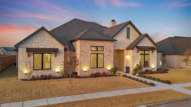 view of front of house with a yard