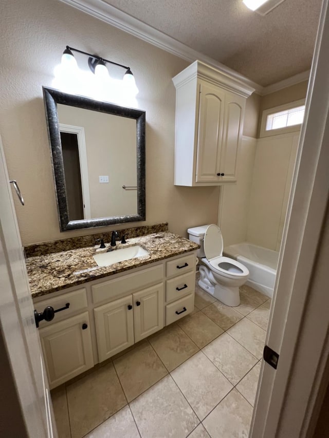 bathroom featuring tile patterned flooring, vanity, ornamental molding, toilet, and a textured ceiling