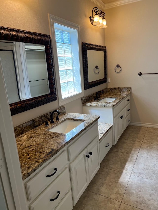 bathroom featuring crown molding, vanity, and tile patterned floors