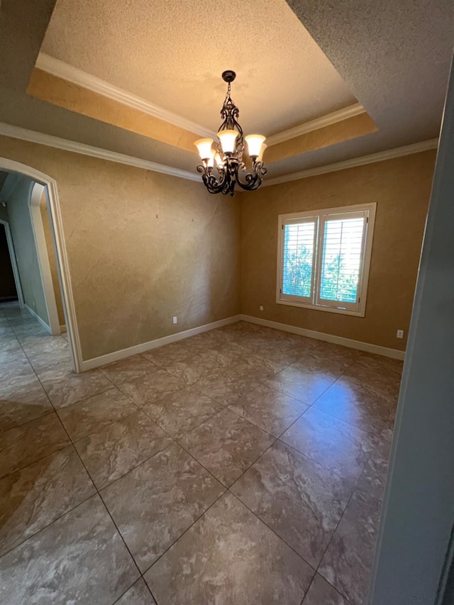 interior space featuring a raised ceiling, crown molding, a notable chandelier, and a textured ceiling