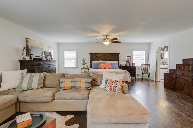 bedroom with ceiling fan and an AC wall unit