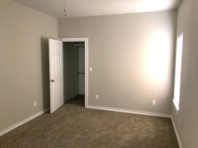 carpeted empty room with a wealth of natural light