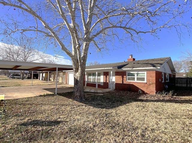 view of front of home featuring a carport