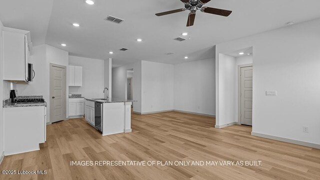 426 14th St, Wolfforth, TX 79382 - kitchen featuring recessed lighting, a ceiling fan, light wood finished floors, white cabinetry, and open floor plan