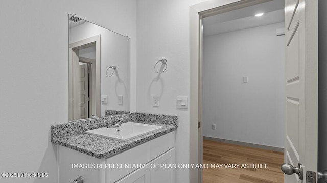 426 14th St, Wolfforth, TX 79382 - bathroom featuring vanity and wood finished floors