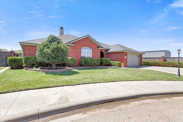 view of front of home with a garage and a front lawn