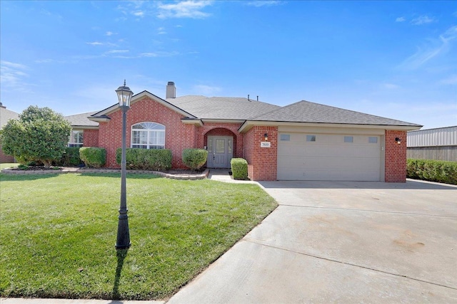 ranch-style home featuring a garage and a front yard