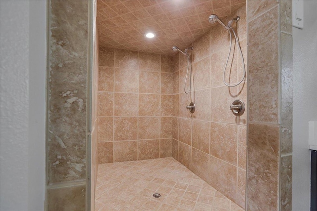 bathroom with a tile shower