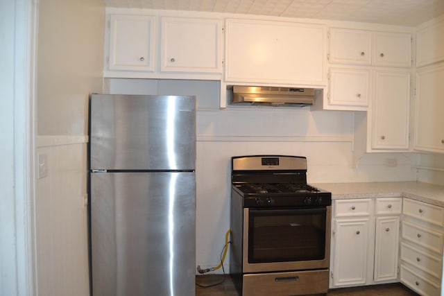 kitchen featuring stainless steel appliances and white cabinetry