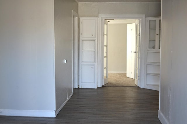 hall with dark hardwood / wood-style flooring