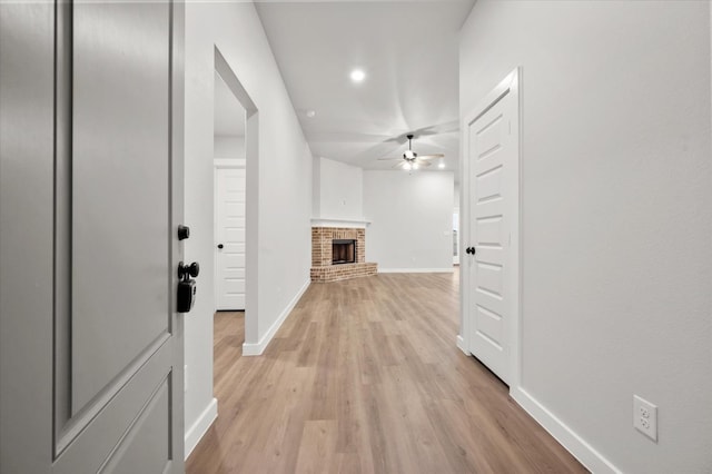 corridor featuring light hardwood / wood-style flooring