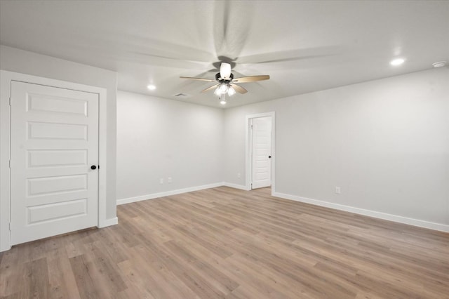 unfurnished room featuring ceiling fan and light wood-type flooring