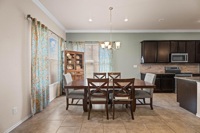 dining space with a notable chandelier, light tile patterned floors, and ornamental molding