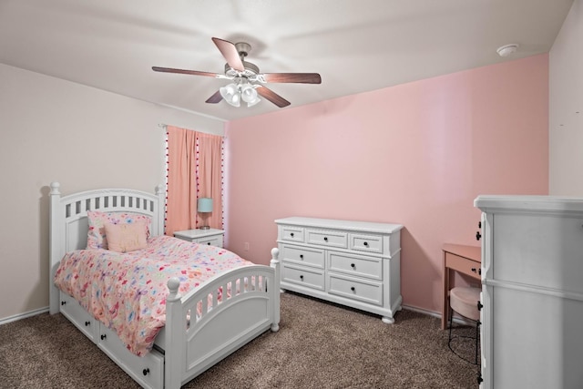 bedroom featuring ceiling fan and dark carpet