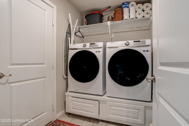 7511 31st St, Lubbock, TX 79407 - laundry room featuring washer and dryer and light tile patterned floors