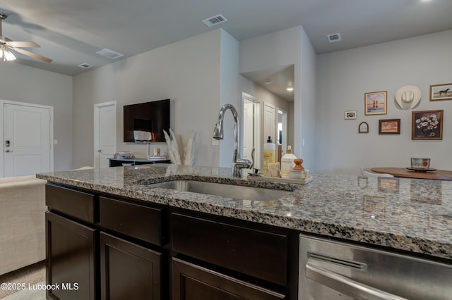 7511 31st St, Lubbock, TX 79407 - kitchen featuring stainless steel dishwasher, ceiling fan, stone countertops, and dark brown cabinets