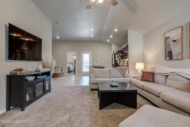 7511 31st St, Lubbock, TX 79407 - living room with lofted ceiling, ceiling fan, recessed lighting, and light colored carpet