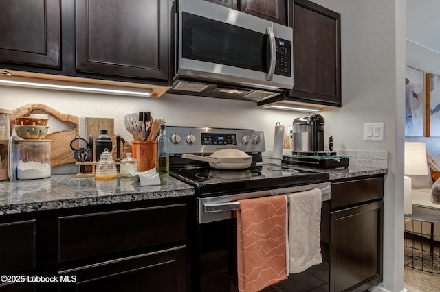 7511 31st St, Lubbock, TX 79407 - kitchen featuring appliances with stainless steel finishes, stone counters, and dark brown cabinetry