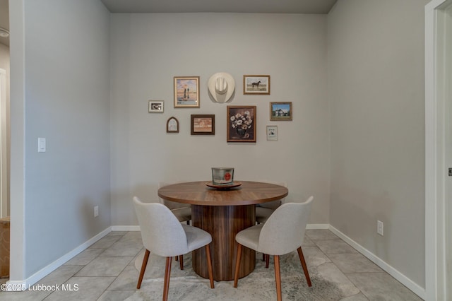 7511 31st St, Lubbock, TX 79407 - dining area featuring baseboards and light tile patterned flooring