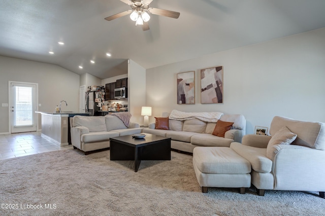7511 31st St, Lubbock, TX 79407 - living area with ceiling fan, recessed lighting, lofted ceiling, light carpet, and light tile patterned floors