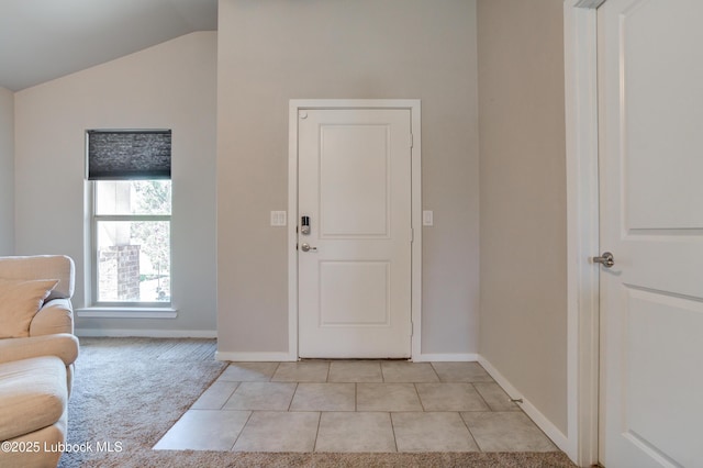 7511 31st St, Lubbock, TX 79407 - entryway with vaulted ceiling, light tile patterned flooring, and light colored carpet