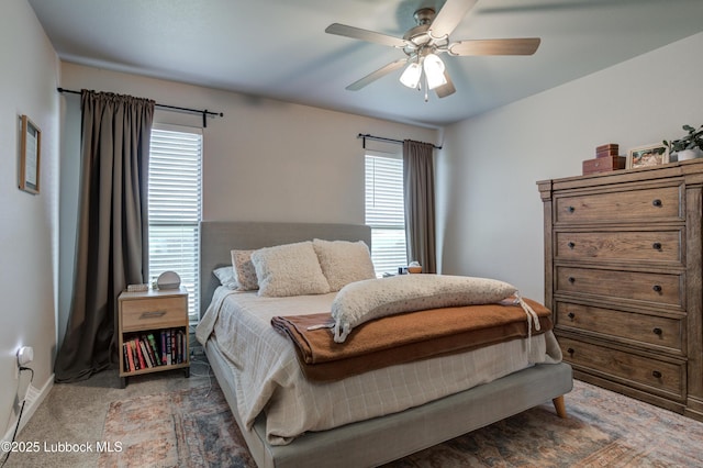 7511 31st St, Lubbock, TX 79407 - carpeted bedroom with multiple windows and a ceiling fan