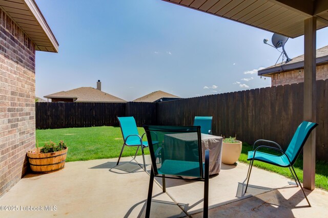 7511 31st St, Lubbock, TX 79407 - fenced backyard with a patio area and outdoor dining area