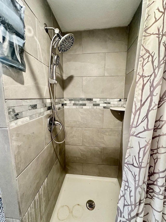 bathroom featuring curtained shower