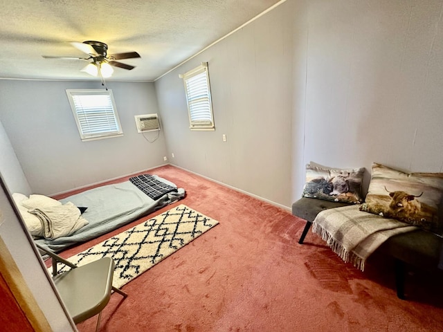 carpeted bedroom featuring multiple windows, ceiling fan, a wall mounted air conditioner, and a textured ceiling