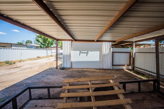 view of patio featuring an outbuilding