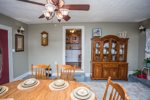 dining space featuring ceiling fan, carpet floors, washer and dryer, and a textured ceiling