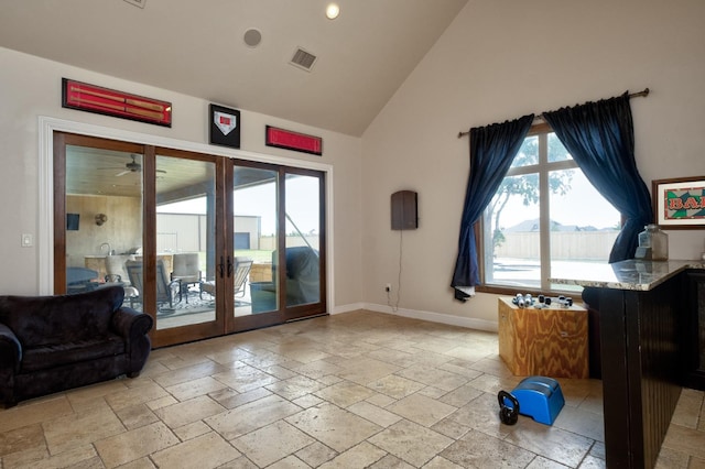 doorway to outside featuring high vaulted ceiling and french doors