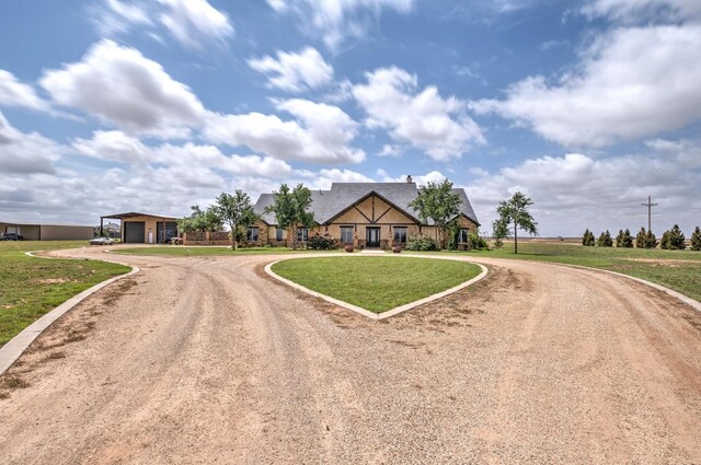 view of front facade with a garage and a front lawn