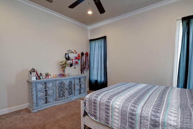 carpeted bedroom with ornamental molding and ceiling fan