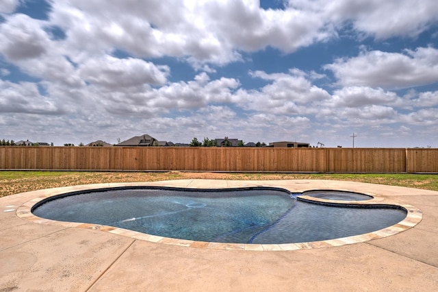 view of pool featuring an in ground hot tub