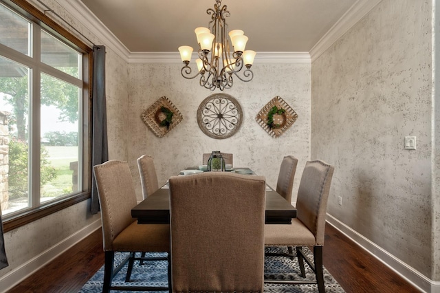 dining room with an inviting chandelier, hardwood / wood-style floors, and crown molding