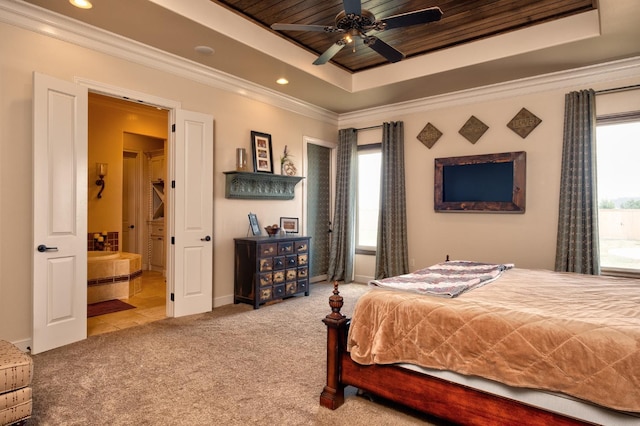 bedroom featuring ensuite bathroom, wood ceiling, light carpet, ornamental molding, and a raised ceiling