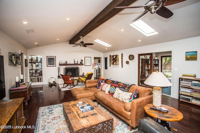 4609 10th St, Lubbock, TX 79416 - living room with ceiling fan, wood finished floors, a skylight, recessed lighting, and a fireplace