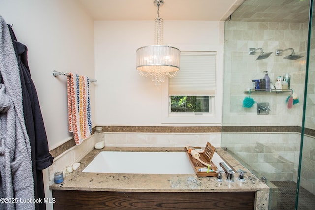 4609 10th St, Lubbock, TX 79416 - full bathroom featuring a stall shower, a chandelier, and a garden tub