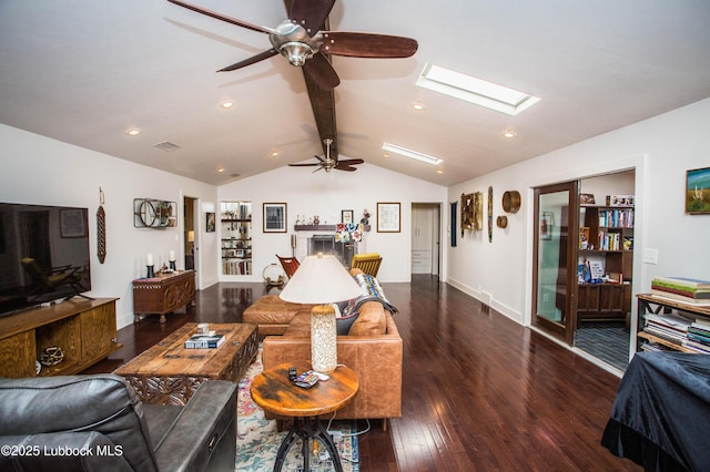 4609 10th St, Lubbock, TX 79416 - living area featuring ceiling fan, hardwood / wood-style flooring, a fireplace, a skylight, and recessed lighting